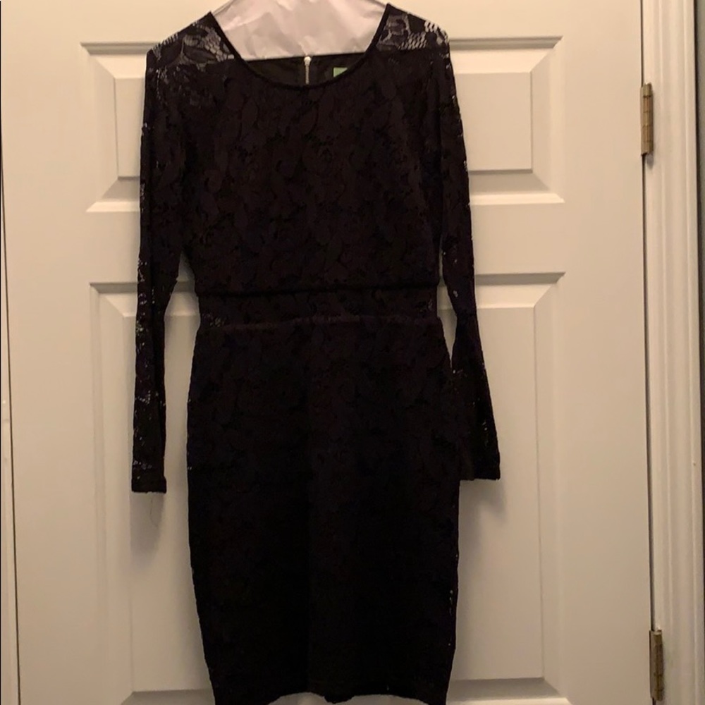 Black cocktail dress- sheer sleeves and midline.